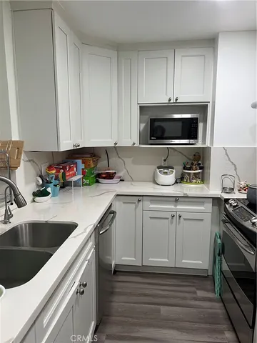 a kitchen with a stove and a microwave