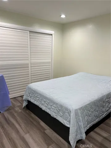 a bedroom with a bed and a table in it