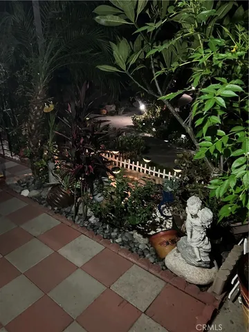 a view of a chair and table in the backyard