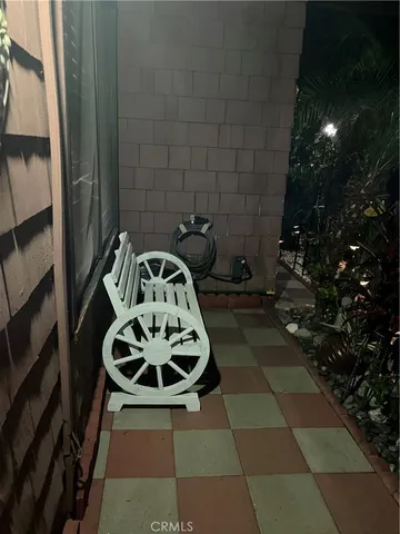 a view of a chairs and table in the patio