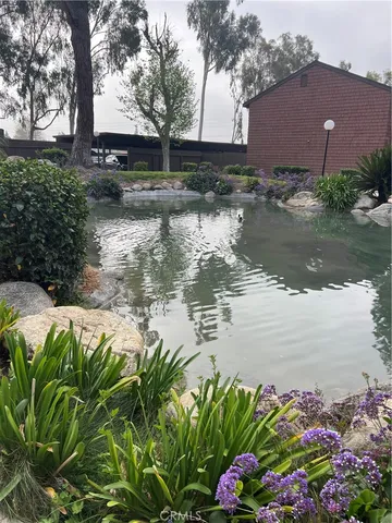 a view of a backyard with sitting area