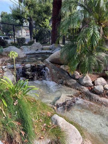 a view of a wooden bench sitting in front of a house