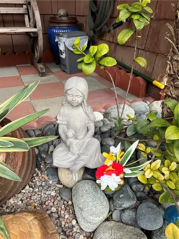 a backyard of a house with lake view and a potted plant