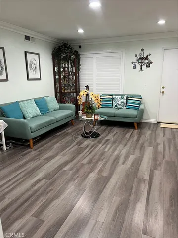 a view of bedroom with furniture and book shelf