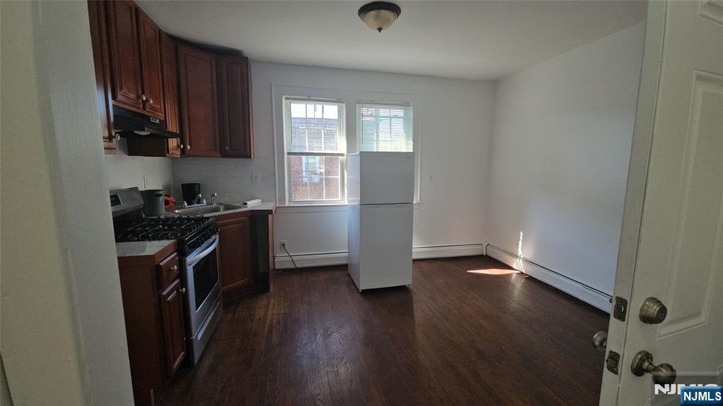 264-266 Pomona Avenue, Unit 3 Newark, NJ 07112 - Photo 19 of 27 an empty room with wooden floor and a window