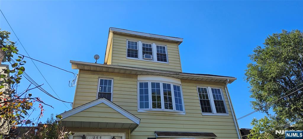 264-266 Pomona Avenue, Unit 3 Newark, NJ 07112 - Photo 2 of 27 a front view of a house with a yard