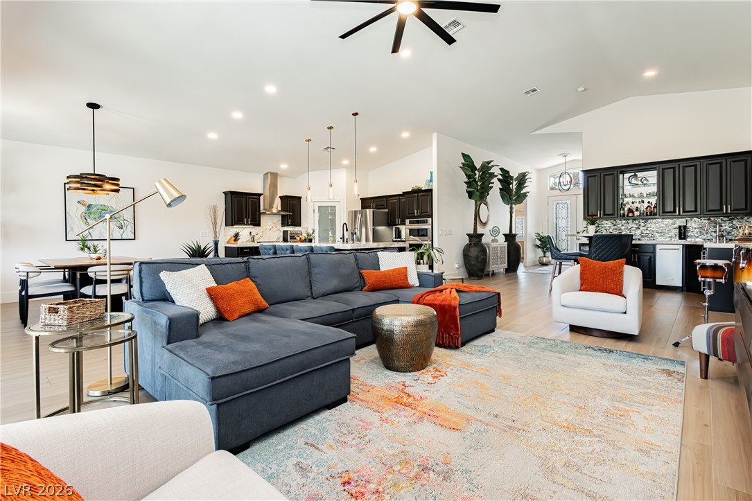 2256 Dogwood Ranch Avenue Henderson, NV 89052 - Photo 51 of 51 An open floorplan seamlessly connects the living area, dining space, and a well-appointed kitchen.