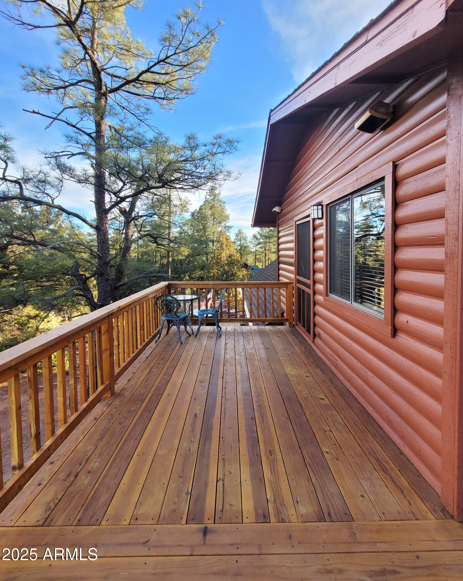 5579 Solitude Trail Loop Pine, AZ 85544 - Photo 11 of 50 a view of balcony with chairs and wooden floor