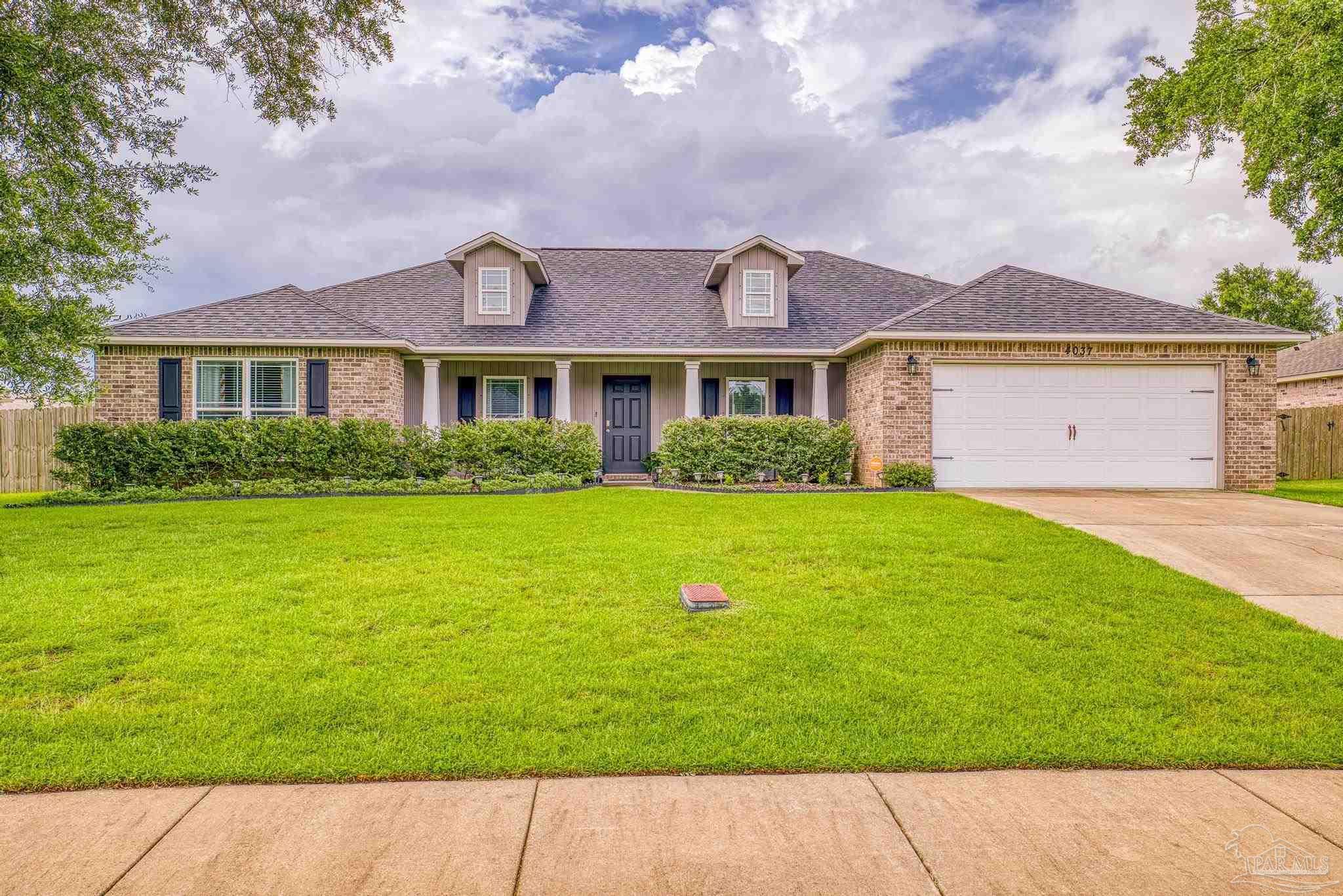 4037 Millwright Way Pace, FL 32571 - Photo 1 of 46 a view of house with garden