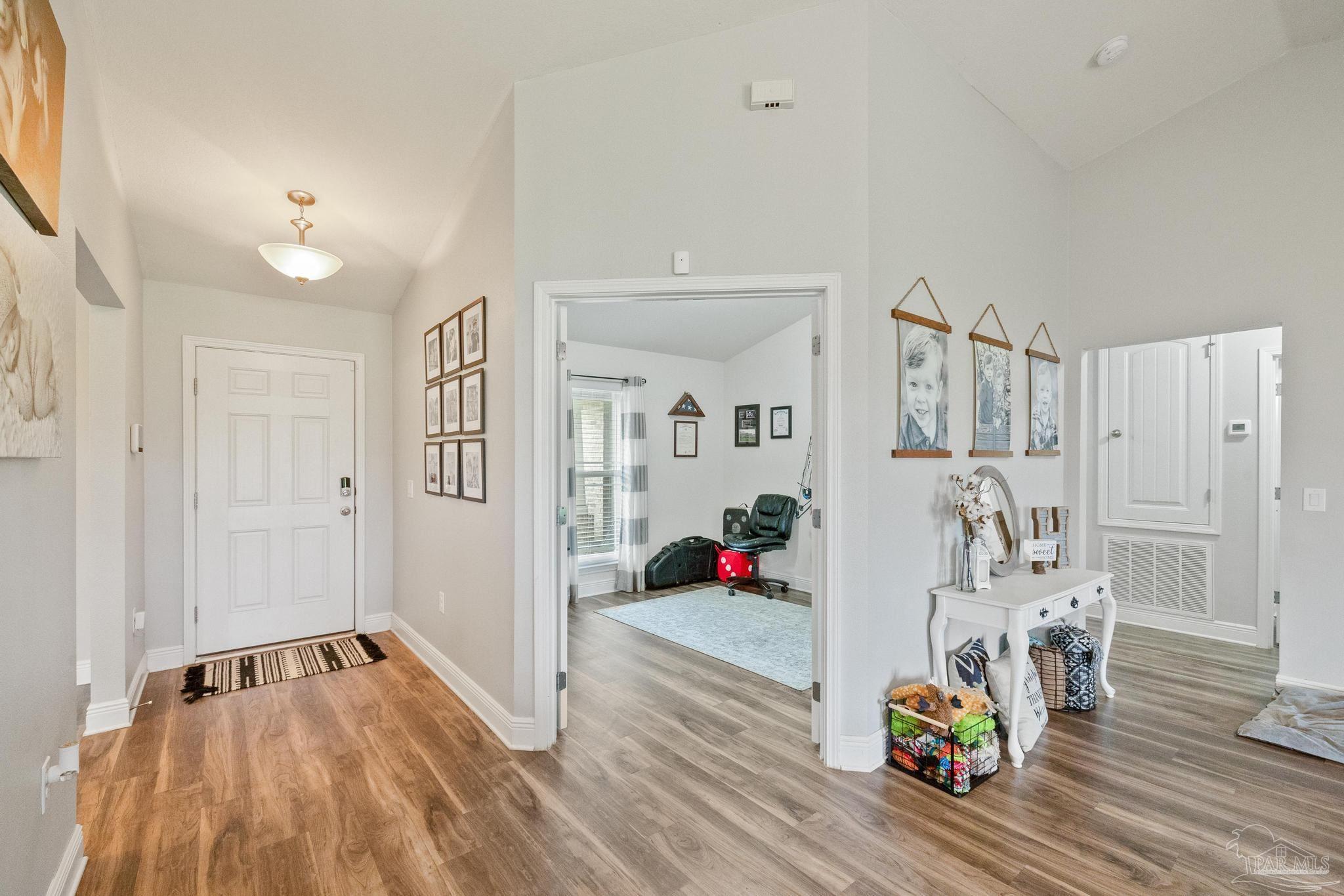 4037 Millwright Way Pace, FL 32571 - Photo 11 of 46 a view of livingroom with furniture and wooden floor