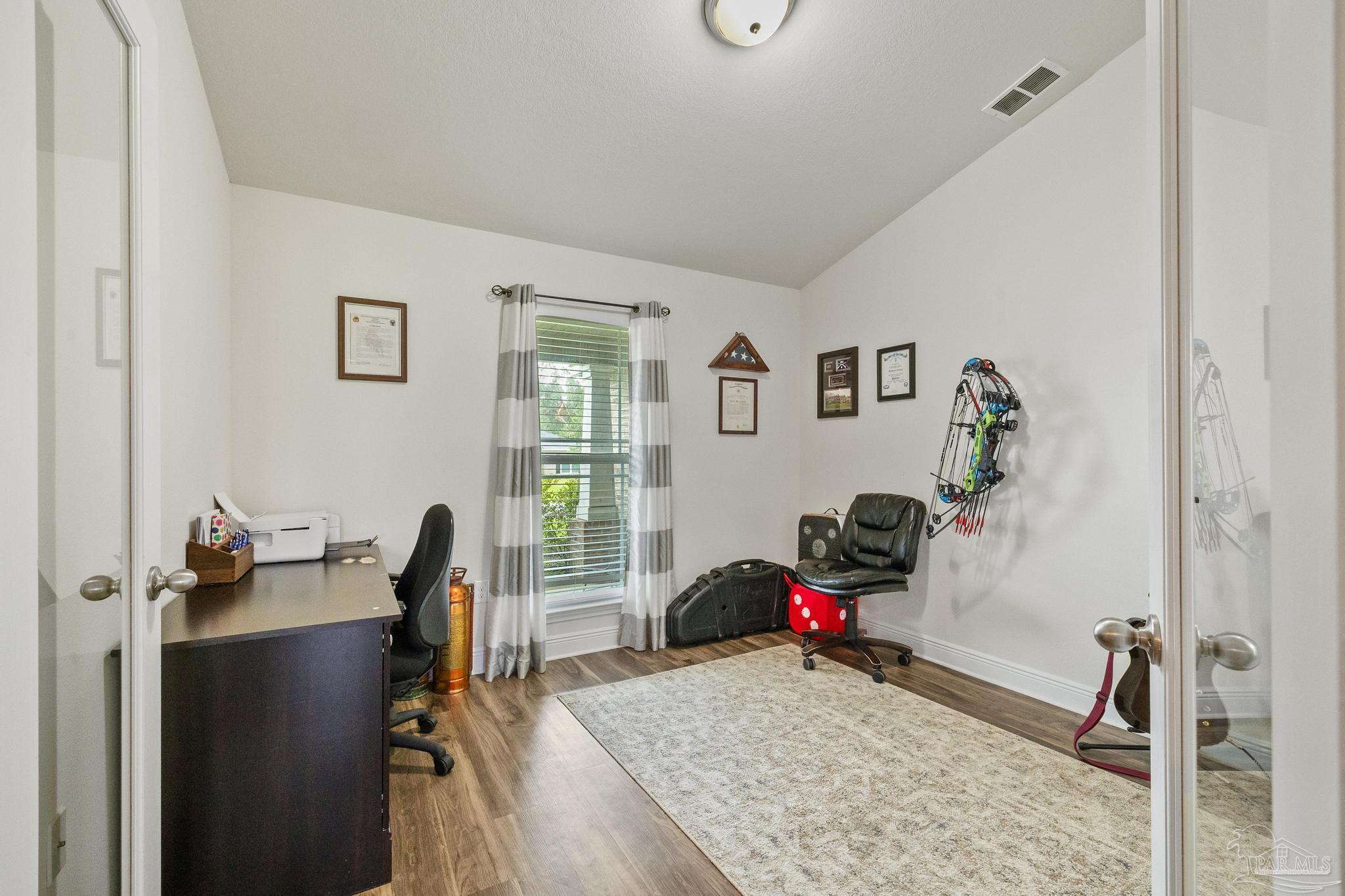 4037 Millwright Way Pace, FL 32571 - Photo 12 of 46 a living room with furniture and a window
