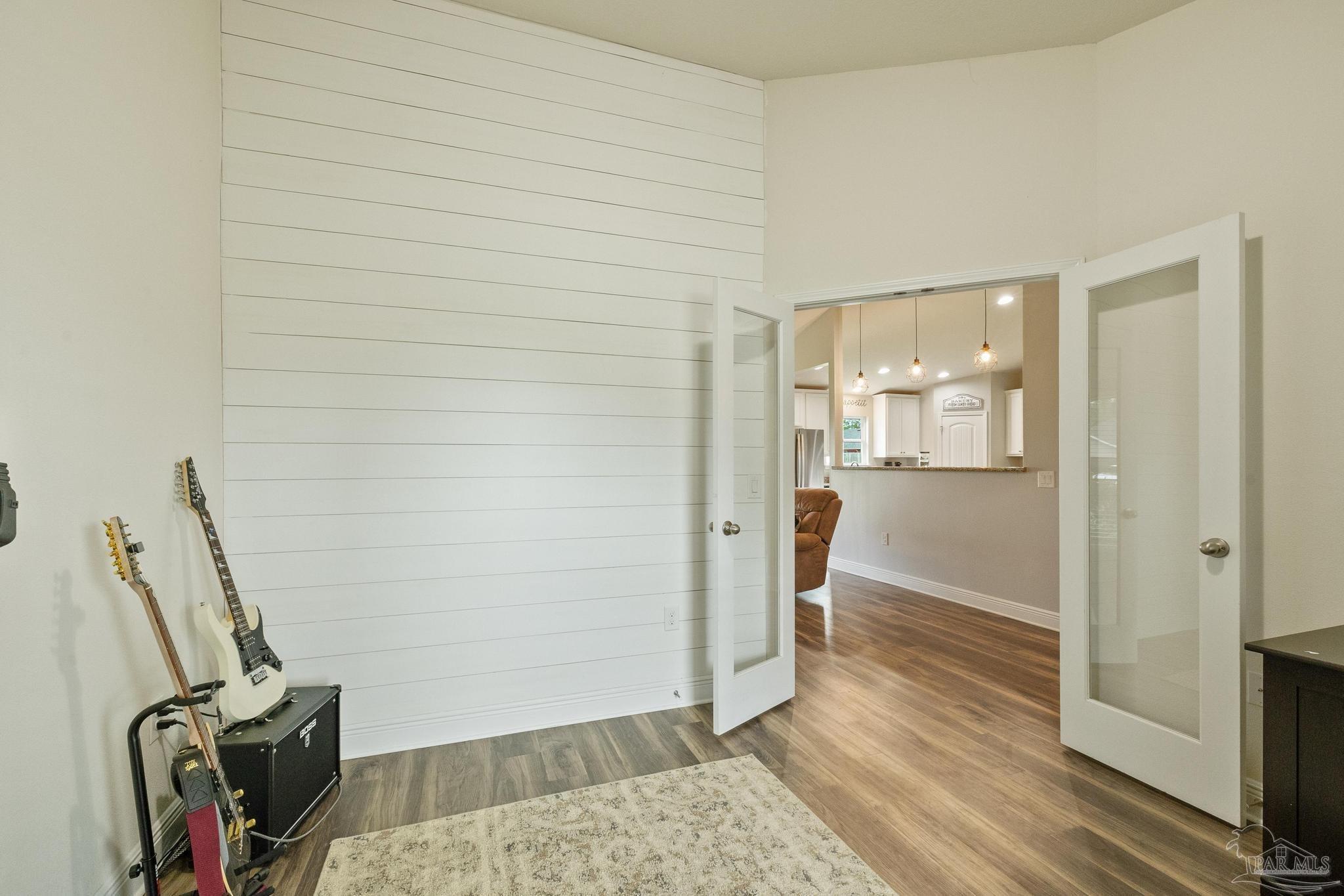 4037 Millwright Way Pace, FL 32571 - Photo 13 of 46 a view of a hallway with wooden floor