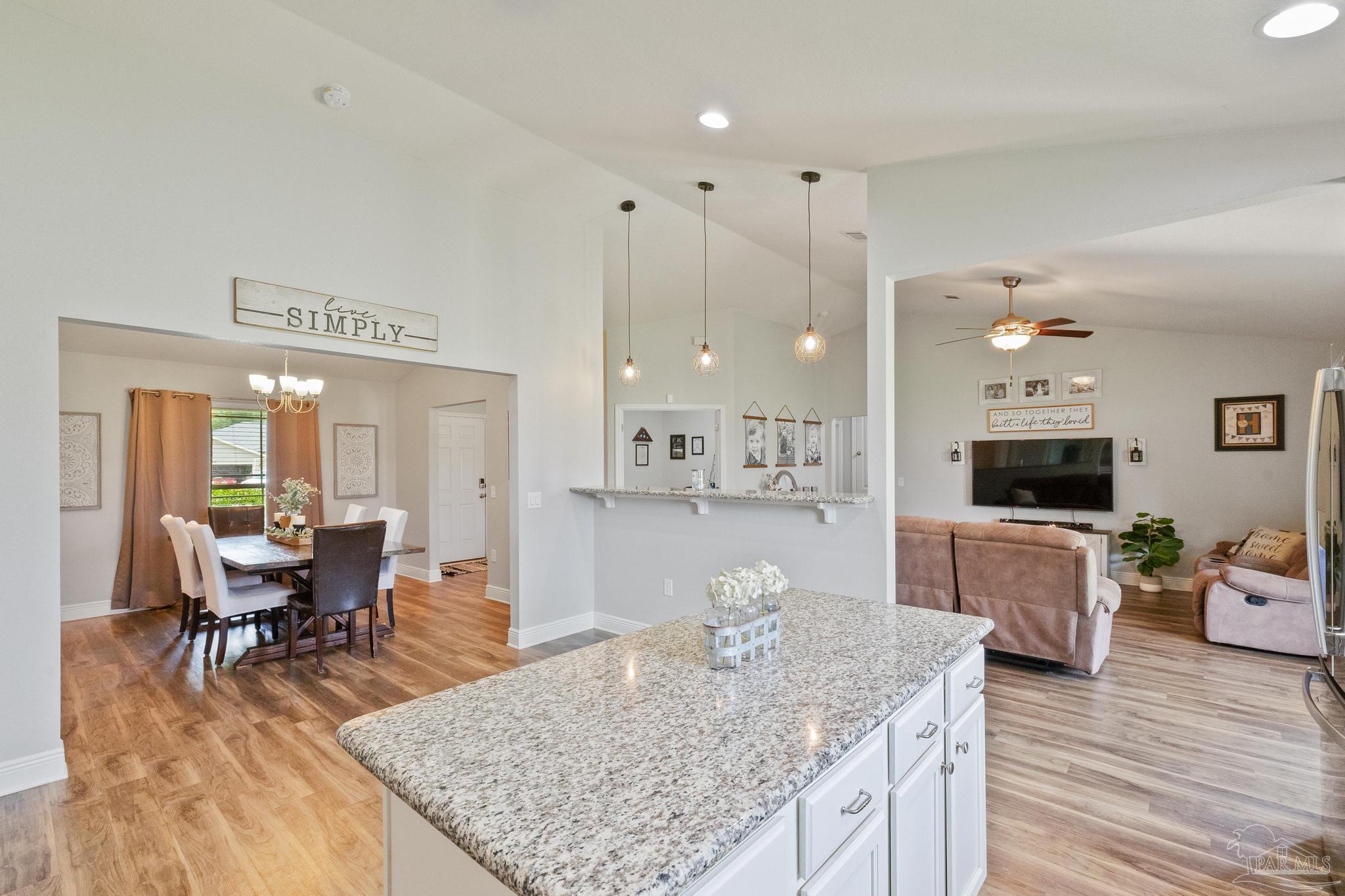 4037 Millwright Way Pace, FL 32571 - Photo 24 of 46 a living room with furniture and wooden floor