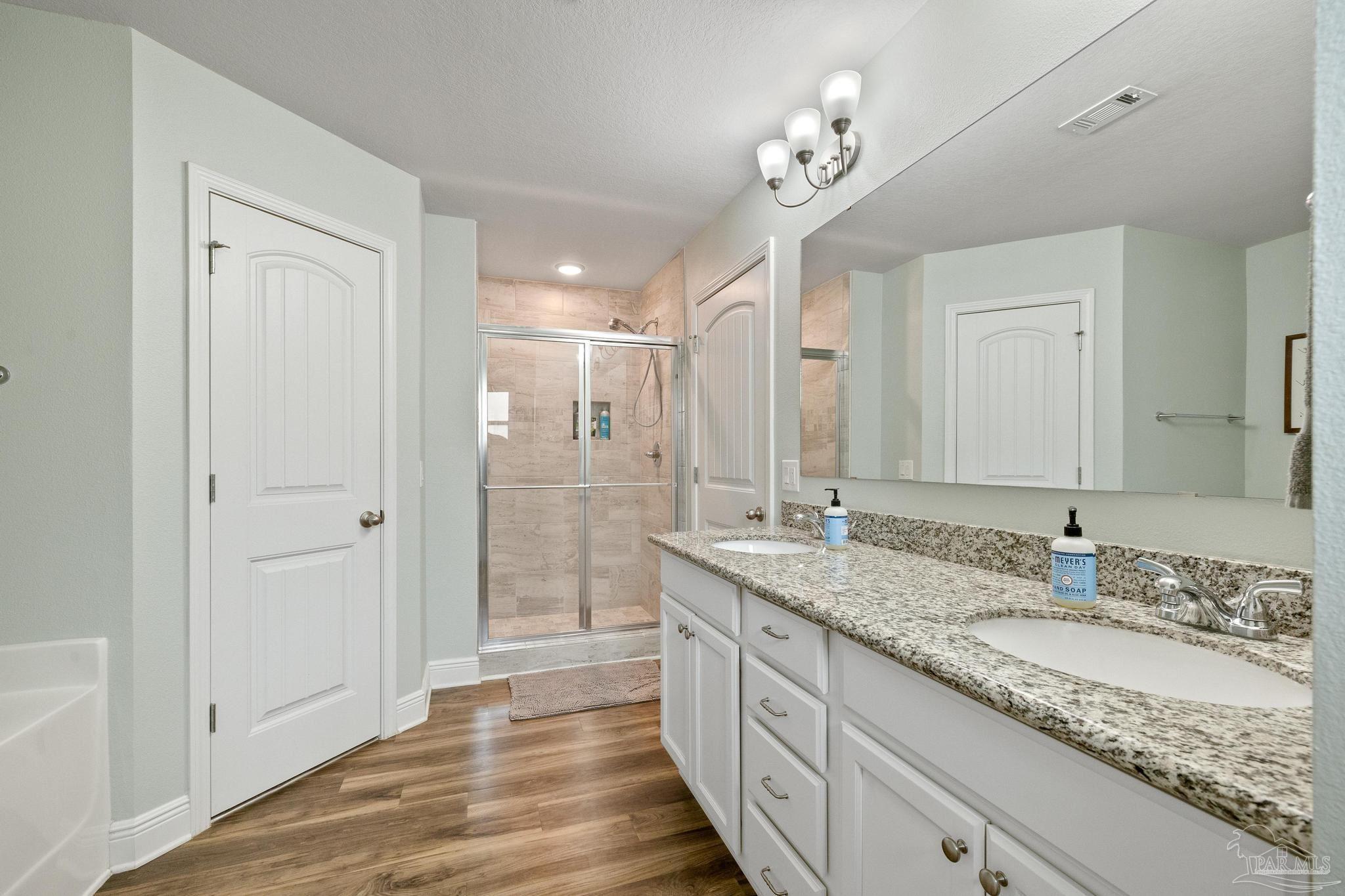 4037 Millwright Way Pace, FL 32571 - Photo 28 of 46 a bathroom with a granite countertop double vanity sink and a mirror