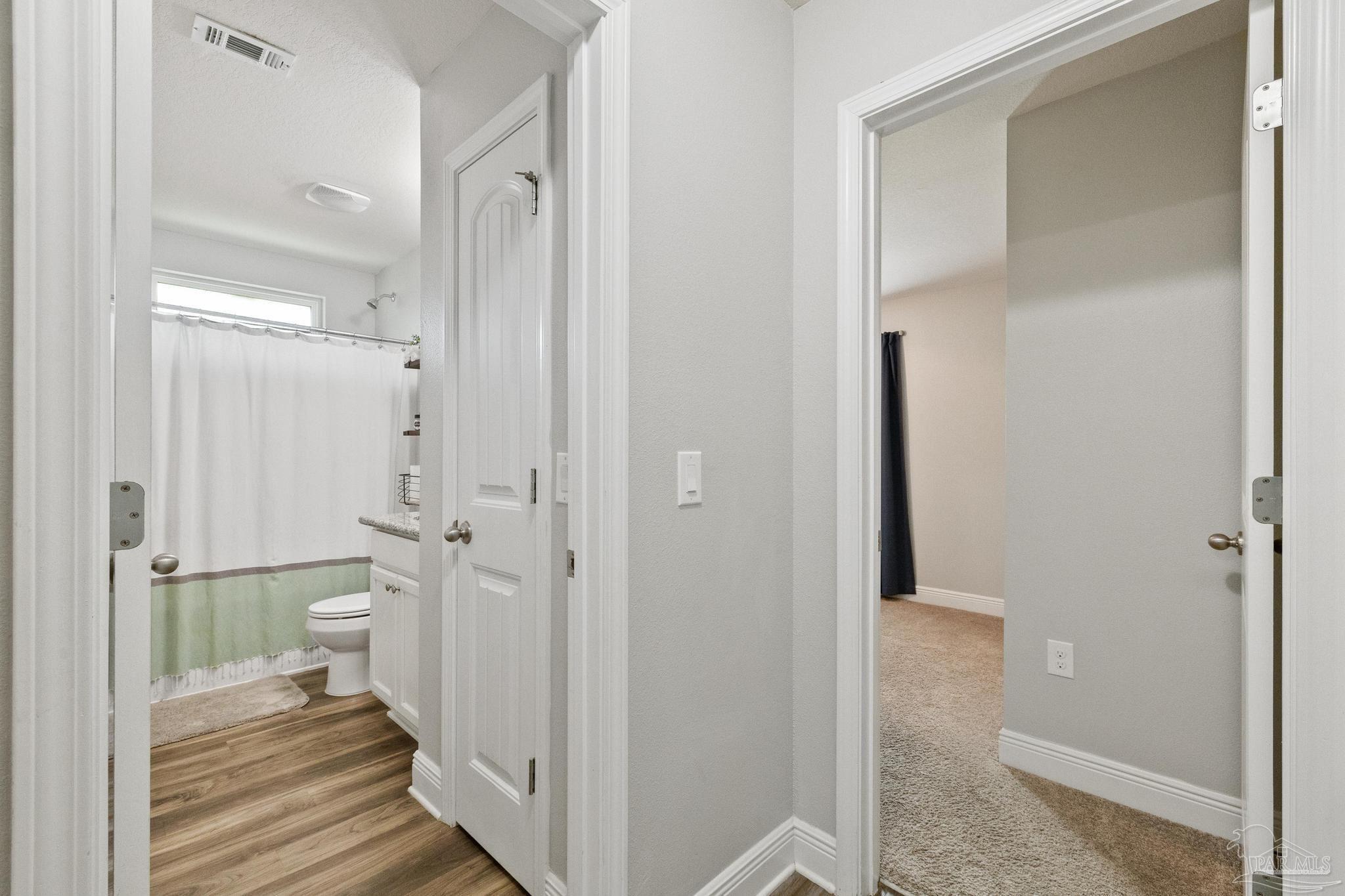 4037 Millwright Way Pace, FL 32571 - Photo 30 of 46 a bathroom with a shower and a toilet