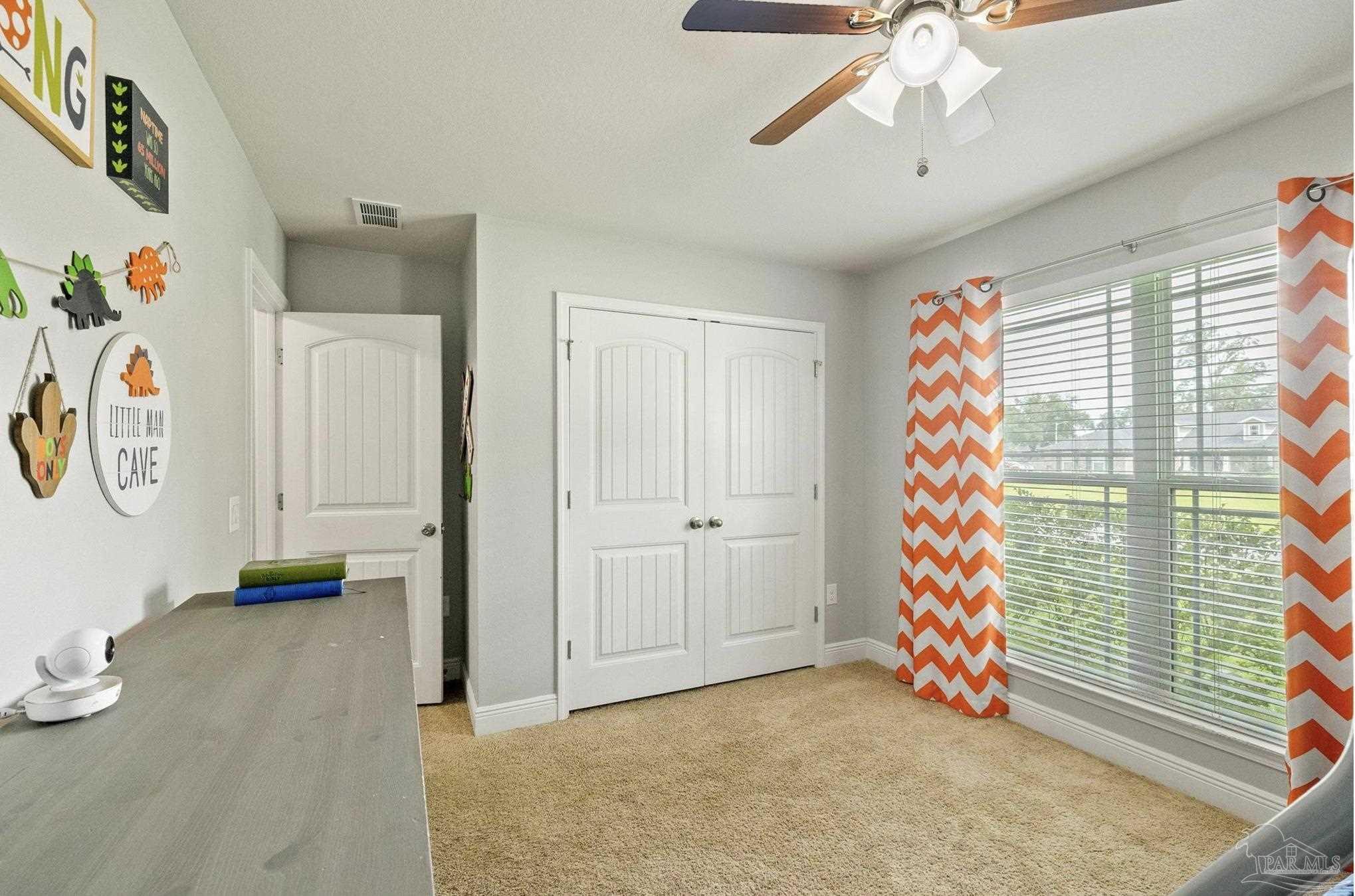 4037 Millwright Way Pace, FL 32571 - Photo 37 of 46 a view of room with toys and a chandelier fan