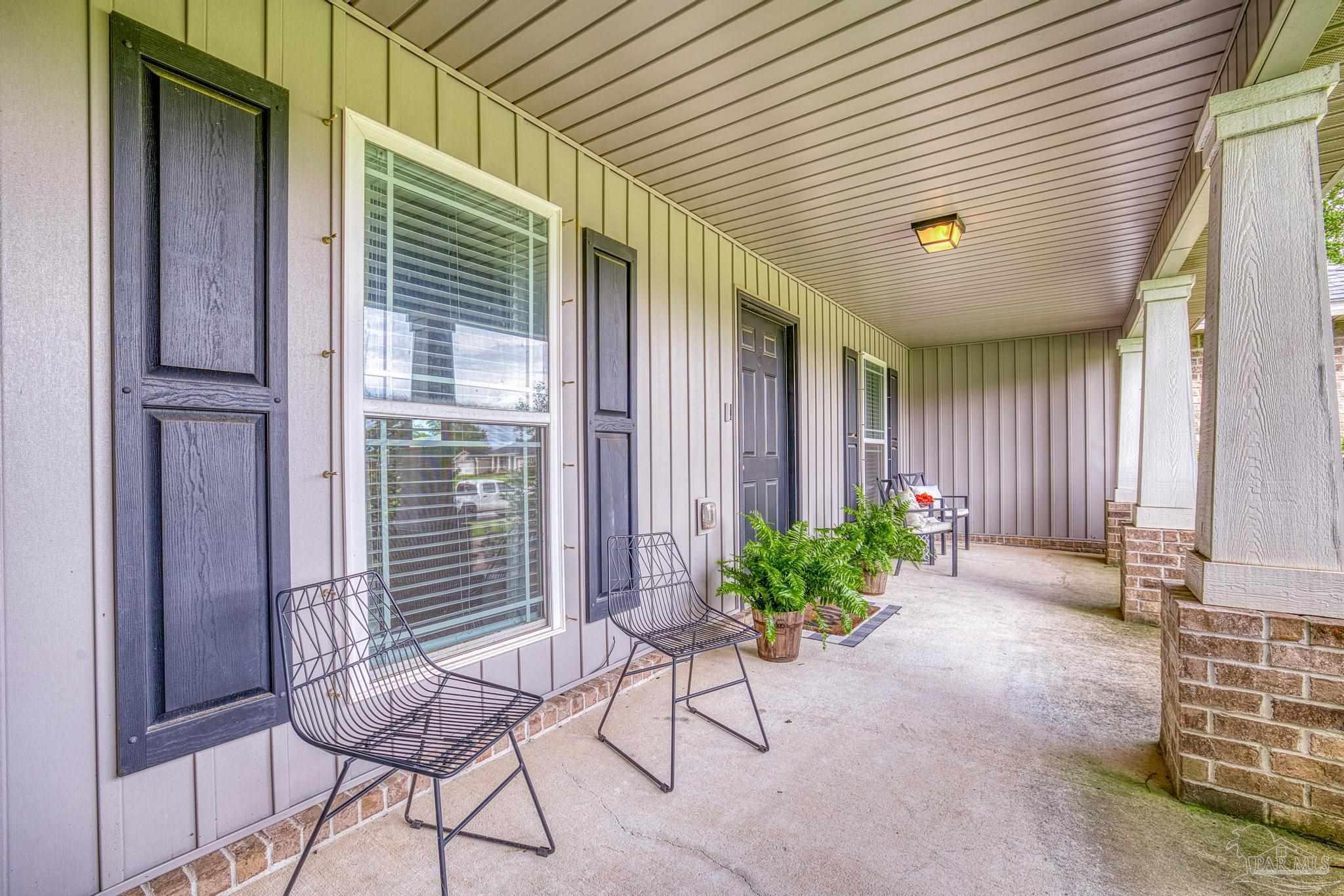 4037 Millwright Way Pace, FL 32571 - Photo 7 of 46 a view of porch with seating space