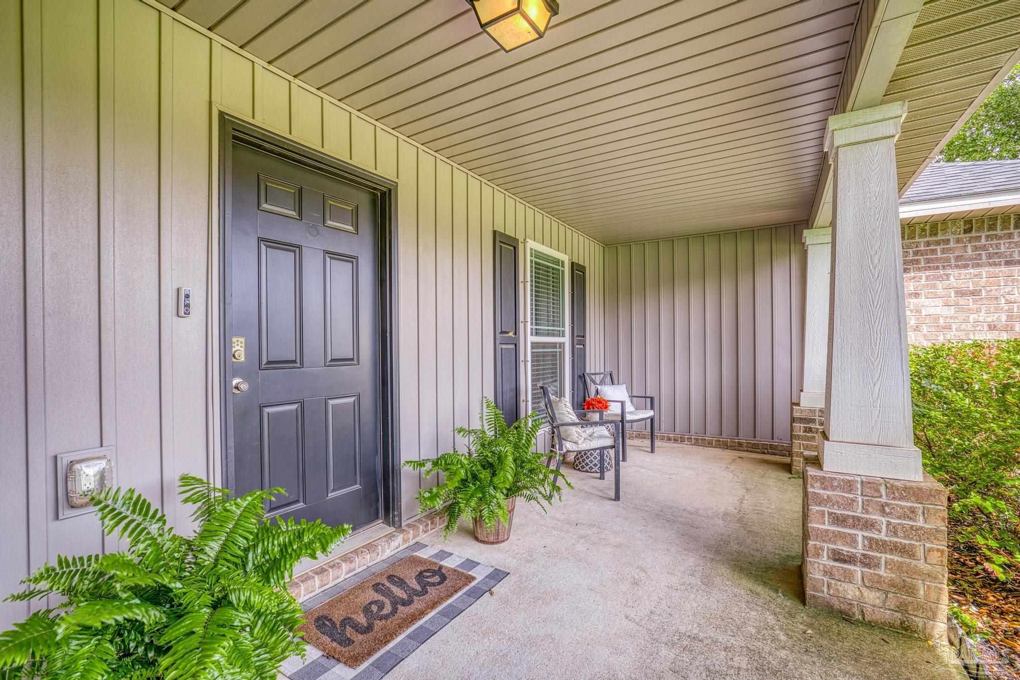 4037 Millwright Way Pace, FL 32571 - Photo 9 of 46 a backyard of a house with potted plants and couches