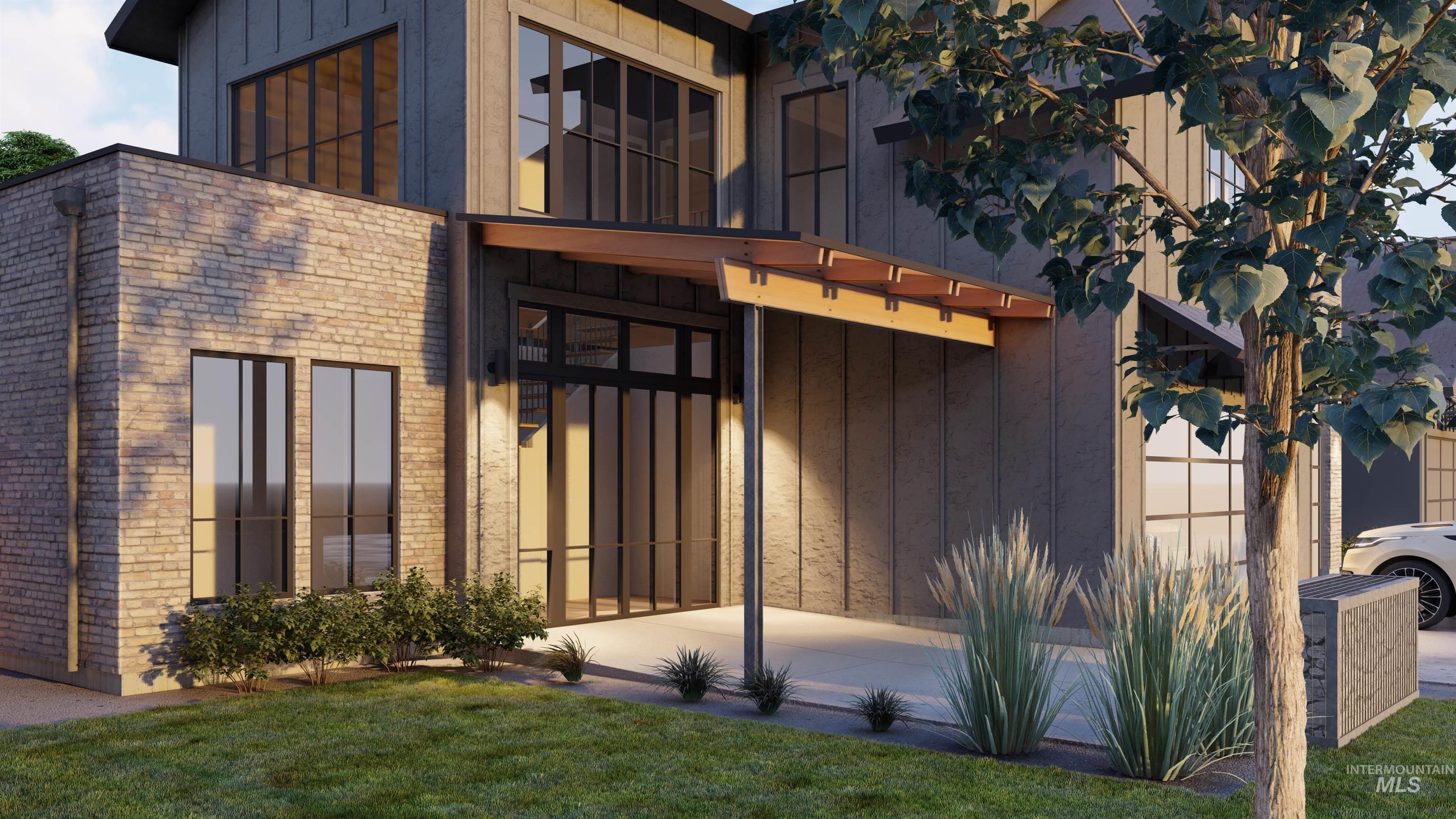 134 South Carbon Rivet Avenue Eagle, ID 83616 - Photo 2 of 20 Double front door with lots of surrounding windows & brick