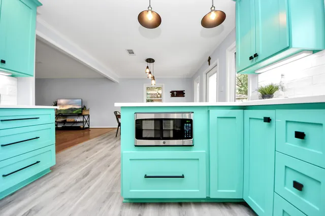 a spacious bathroom with a double vanity sink a mirror and a shower