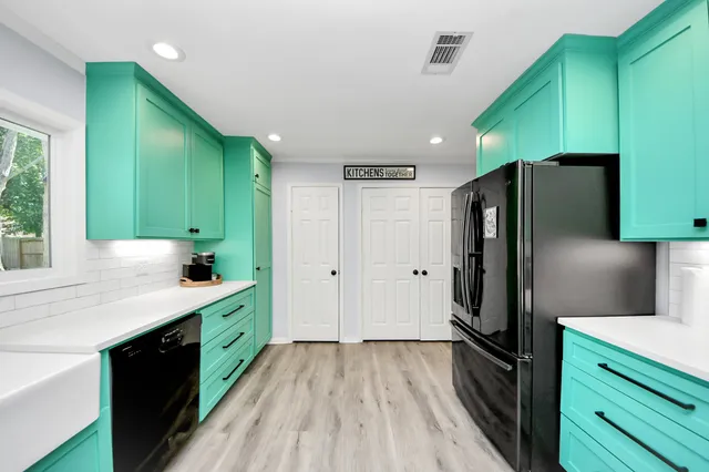 a kitchen with a stove and a refrigerator