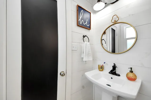 a bathroom with a sink and a mirror