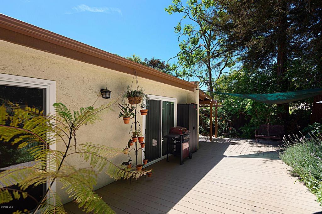 595 Racquet Club Lane Thousand Oaks, CA 91360 - Photo 21 of 23 a view of a patio with glass top table and chairs