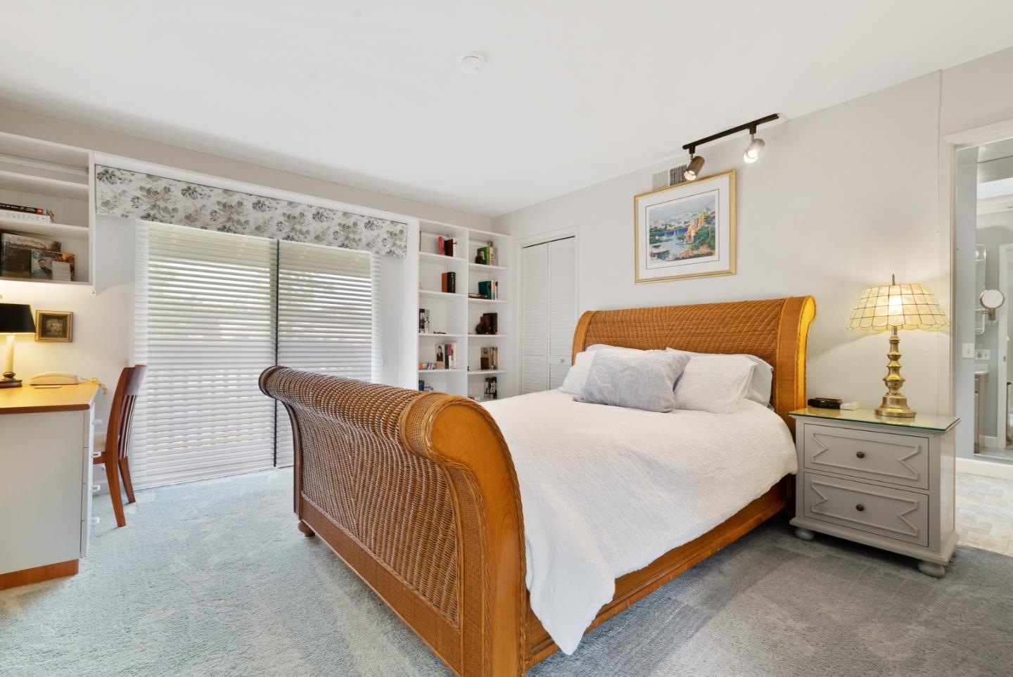 3850 Rio Road, Unit 21 Carmel, CA 93923 - Photo 17 of 31 a bedroom with a bed and a window