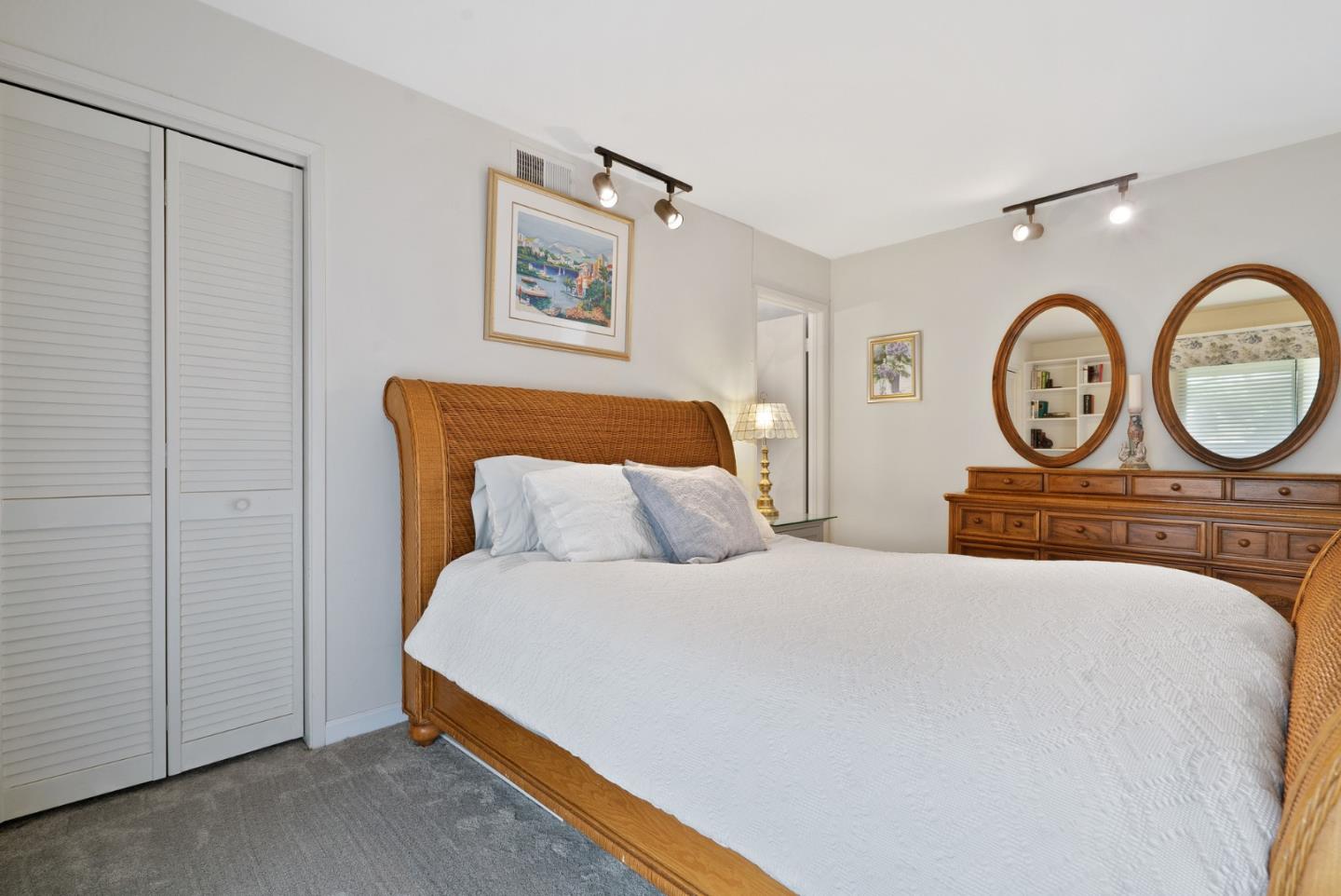 3850 Rio Road, Unit 21 Carmel, CA 93923 - Photo 18 of 31 a bedroom with a bed and two windows