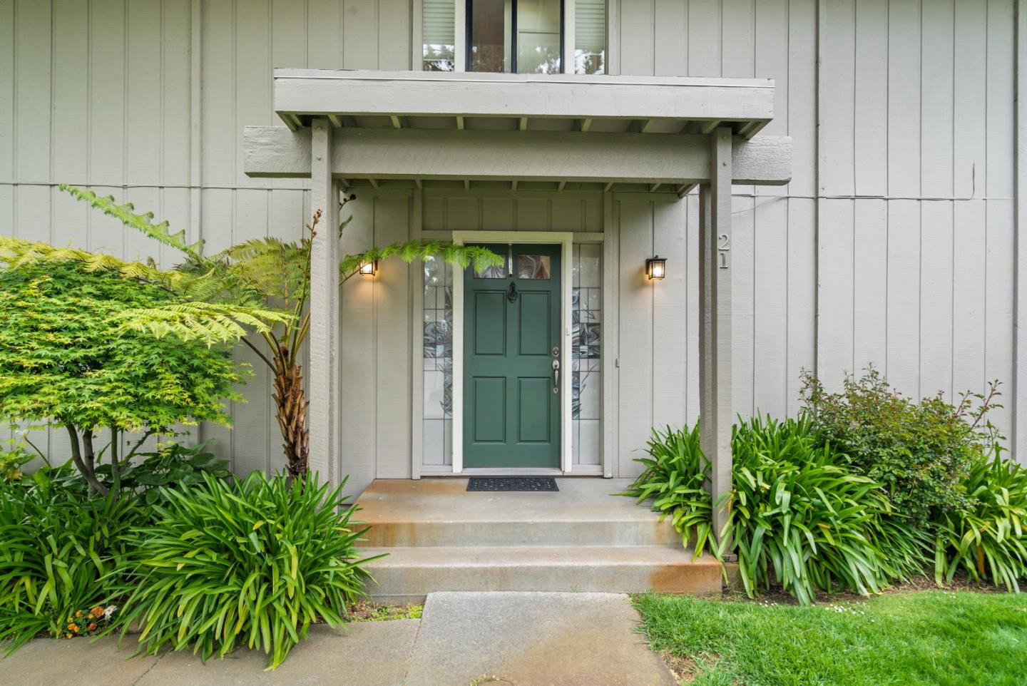 3850 Rio Road, Unit 21 Carmel, CA 93923 - Photo 2 of 31 a front view of a house with garden