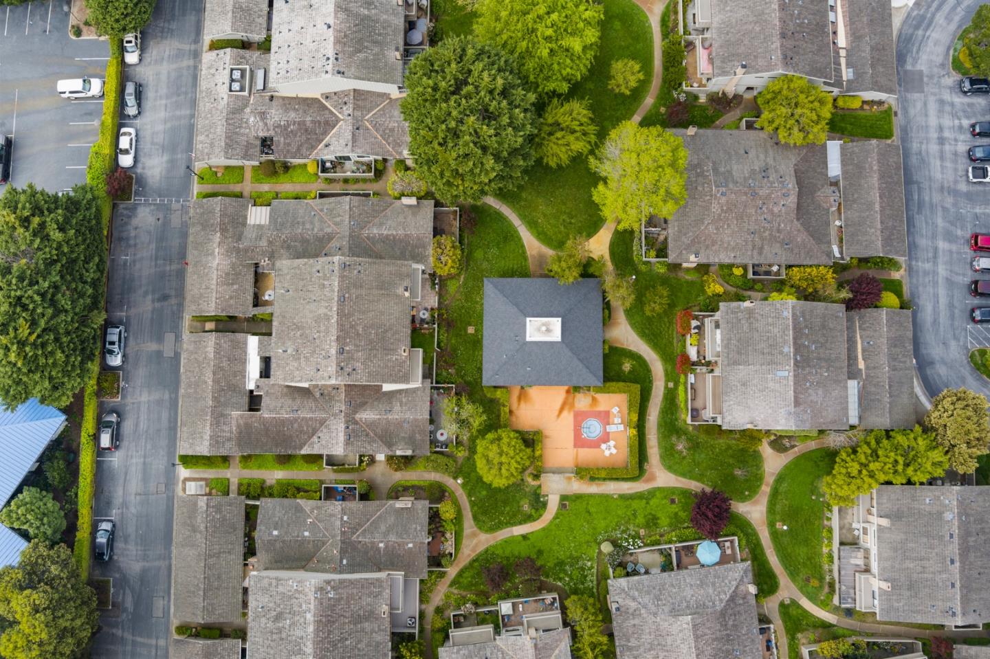 3850 Rio Road, Unit 21 Carmel, CA 93923 - Photo 28 of 31 an aerial view of a house with a yard swimming pool and outdoor seating