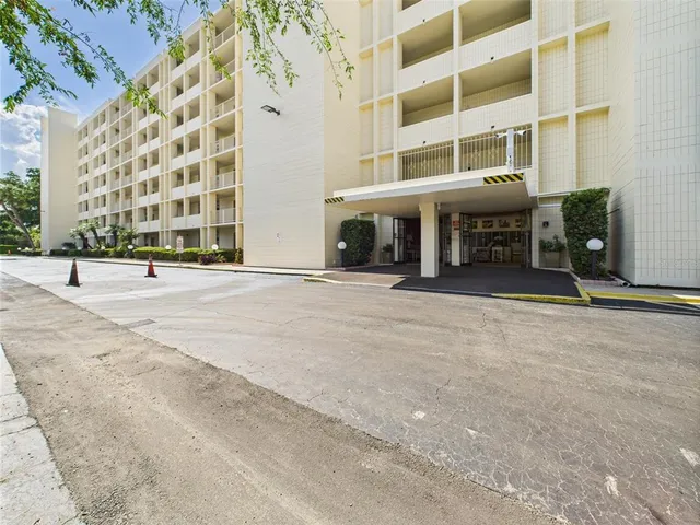 a view of a building with a street