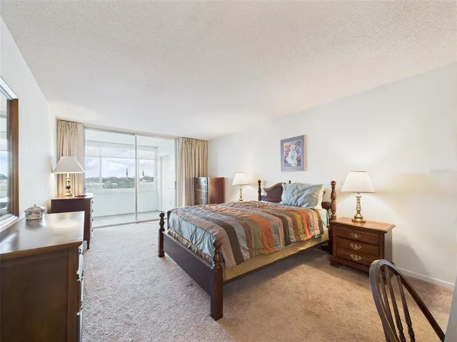 a bathroom with a sink vanity mirror and toilet
