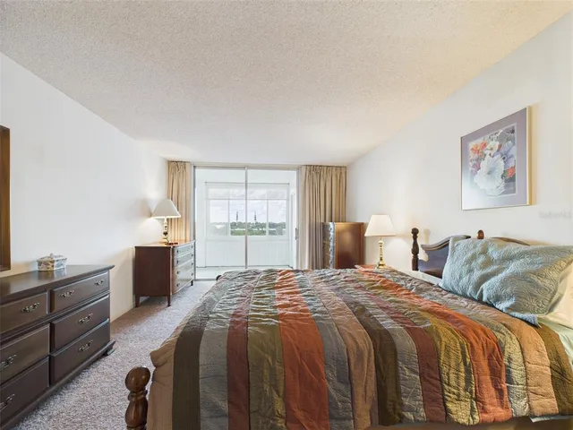 a en suite bathroom with a sink a mirror and shower