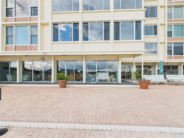 a dining room with furniture and a rug