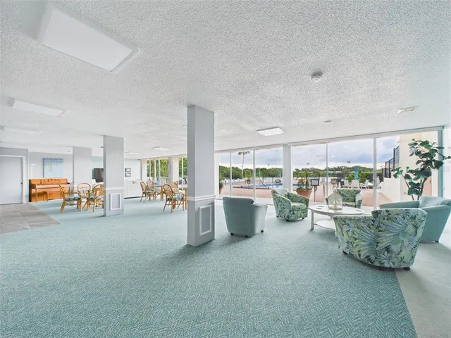 a view of a livingroom with furniture and furniture