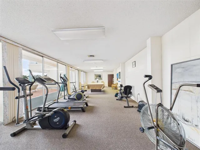 a view of a patio with a table and chairs