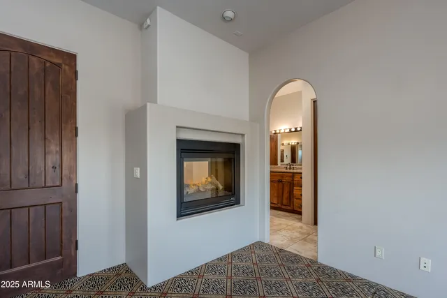 a view of an empty room with windows