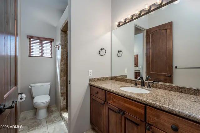 a view of swimming pool with outdoor seating and plants