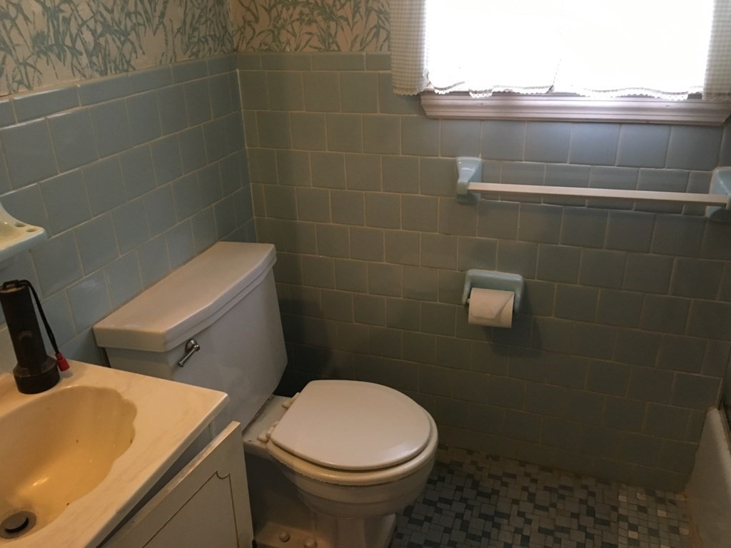 49 Indian Spring Road Ashland, MA 01721 - Photo 16 of 18 a bathroom with a sink and toilet