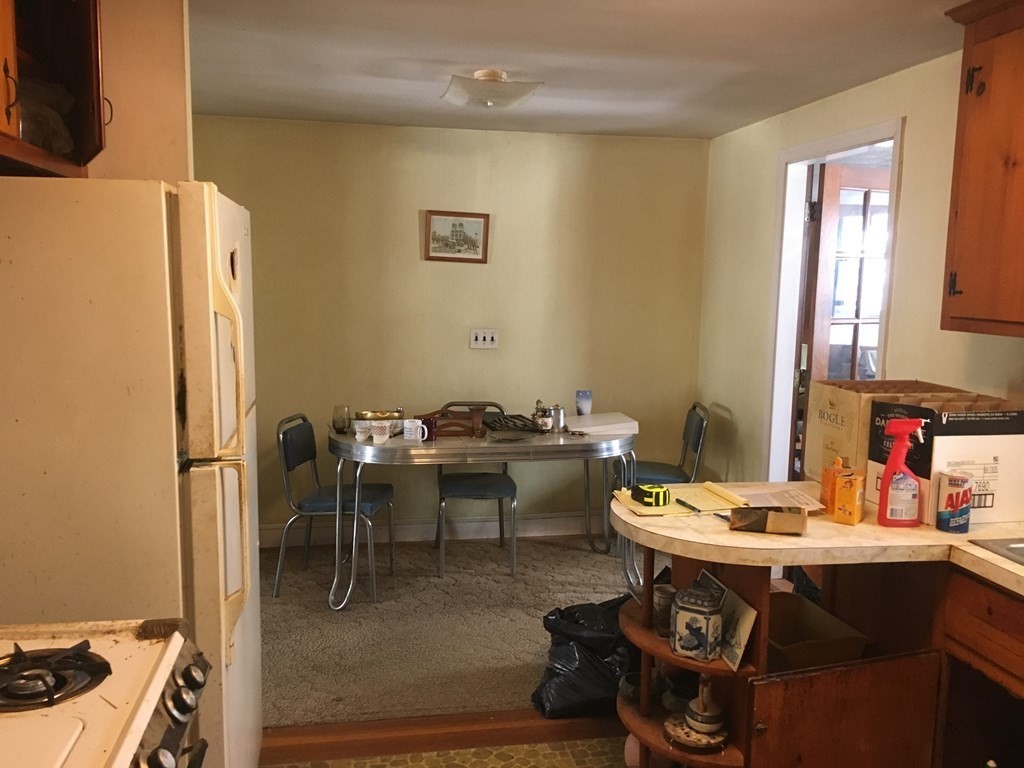 49 Indian Spring Road Ashland, MA 01721 - Photo 6 of 18 a view of a dining room with a table and chairs