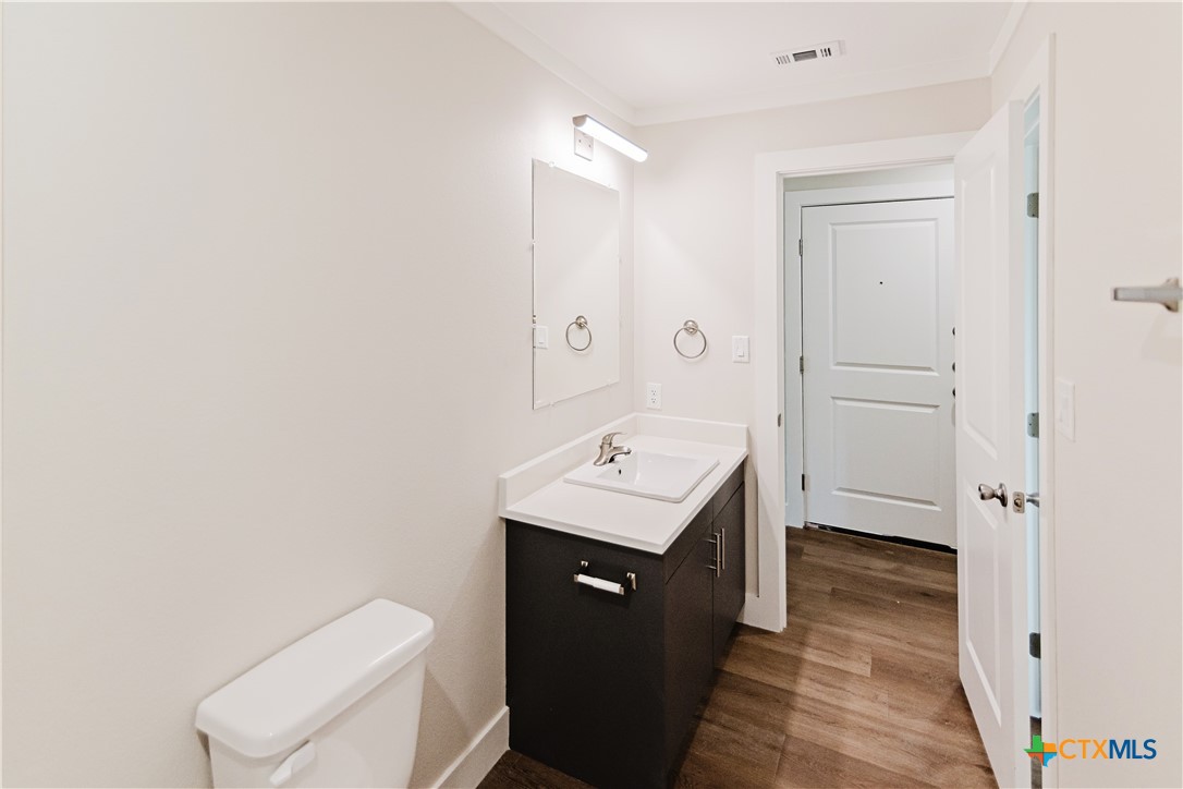 404 Bridge Street Cuero, TX 77954 - Photo 15 of 40 a bathroom with a sink a toilet and shower