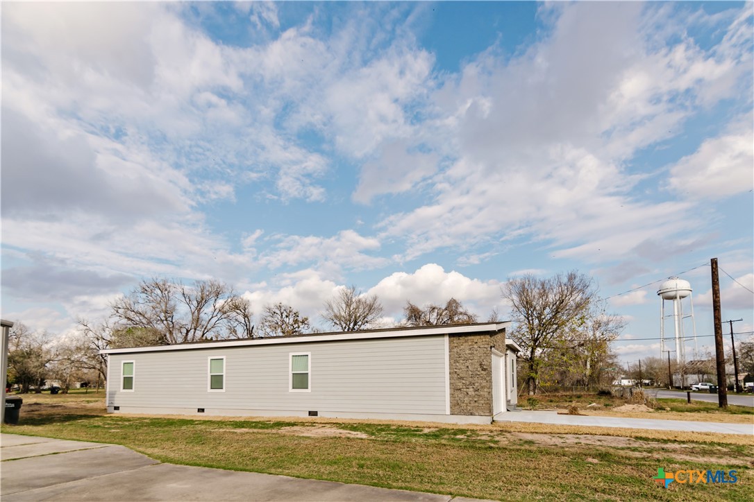 404 Bridge Street Cuero, TX 77954 - Photo 4 of 40 a view of a large white building with many windows