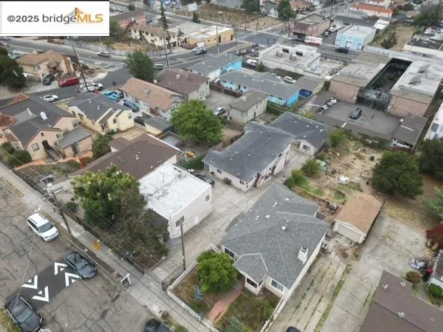 an aerial view of residential houses with outdoor space