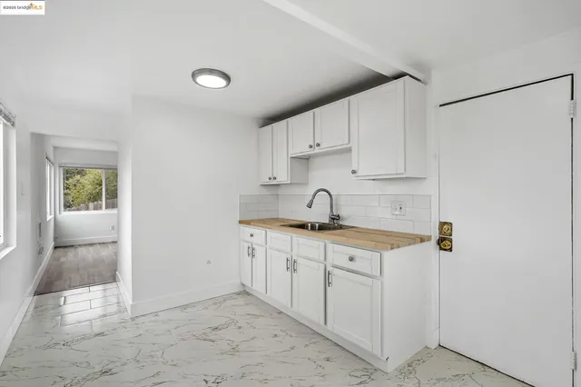 a kitchen with stainless steel appliances granite countertop a sink and cabinets