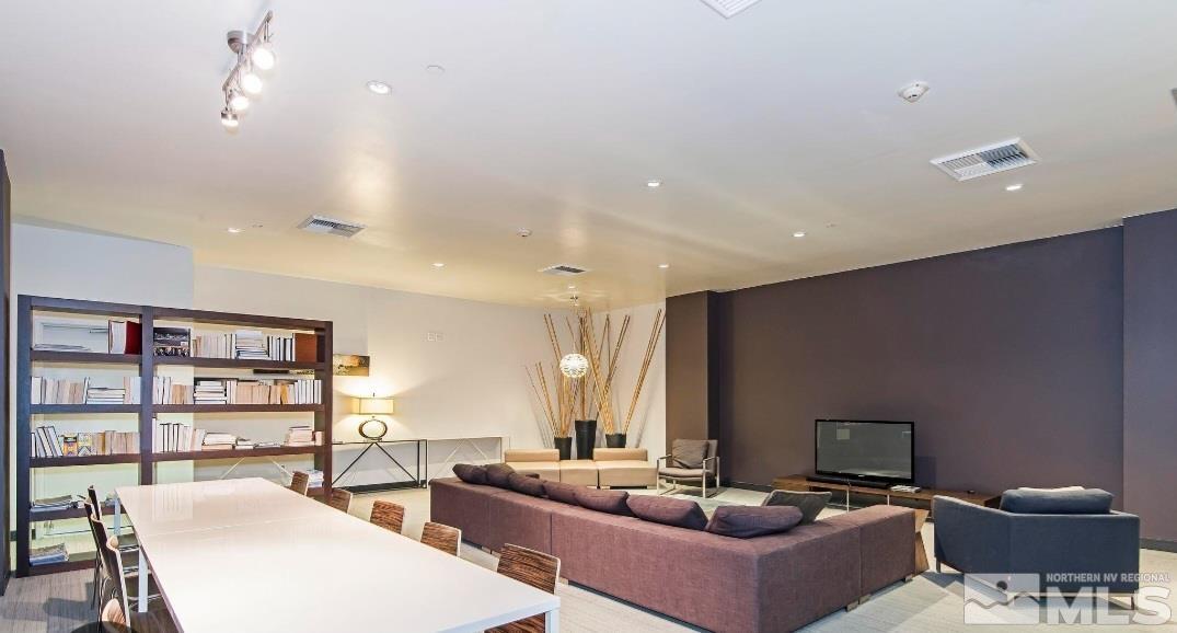 255 North Sierra Street, Unit 801 Reno, NV 89501 - Photo 17 of 32 a living room with furniture a rug and a large window