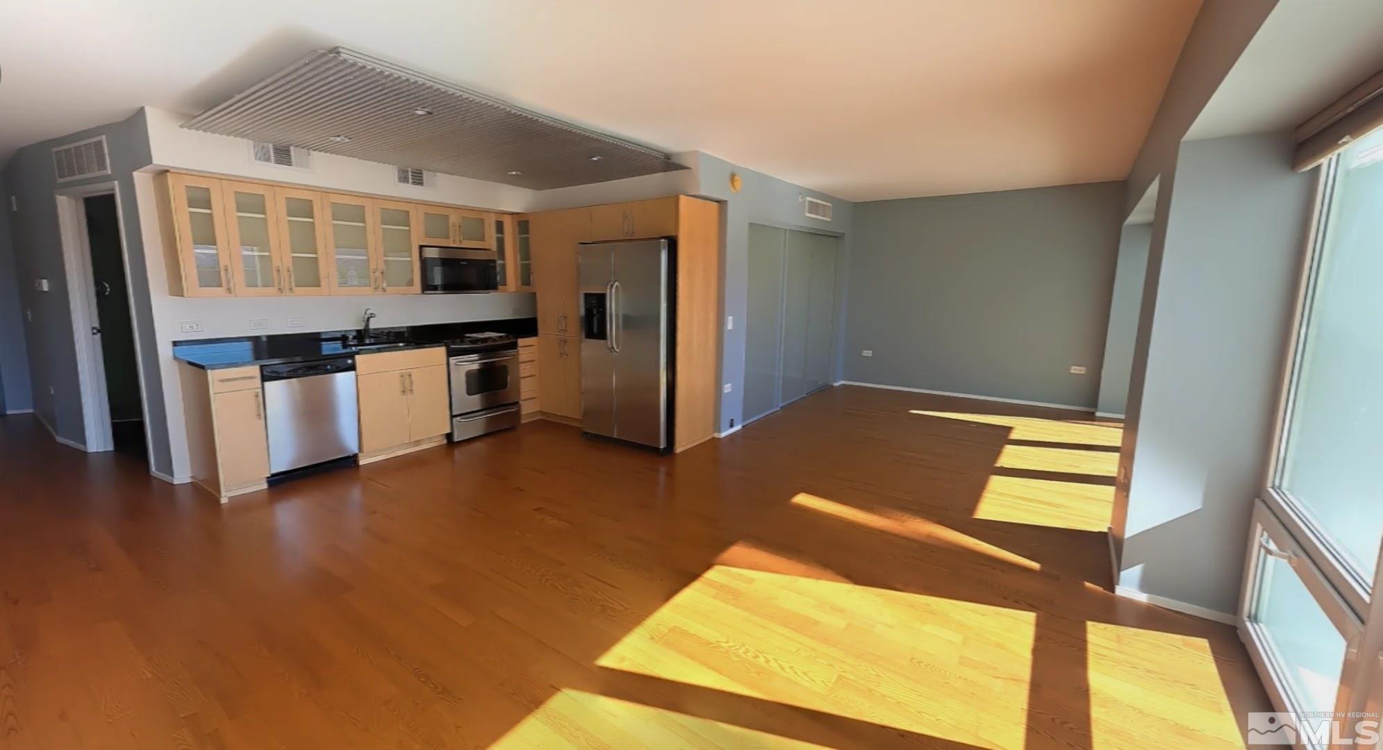 255 North Sierra Street, Unit 801 Reno, NV 89501 - Photo 2 of 32 a view of kitchen with stainless steel appliances cabinets and a large window