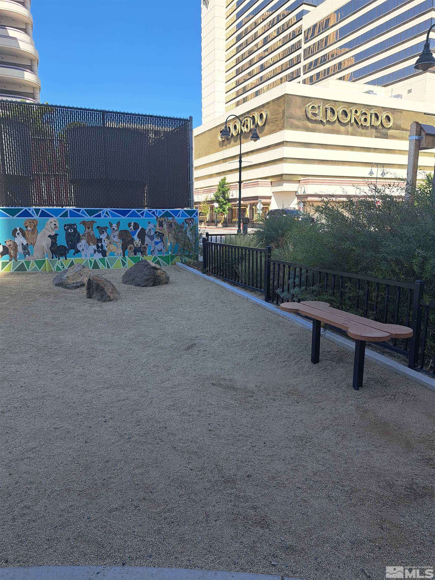 255 North Sierra Street, Unit 801 Reno, NV 89501 - Photo 30 of 32 a view of a street with a bench in front of a house