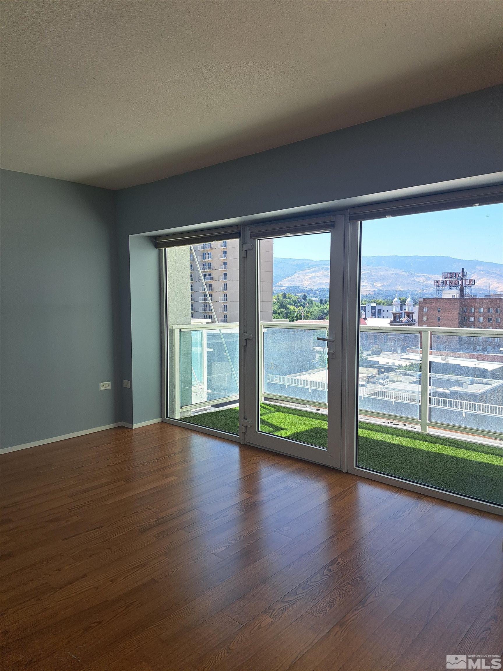 255 North Sierra Street, Unit 801 Reno, NV 89501 - Photo 10 of 32 a view of room with window and wooden floor