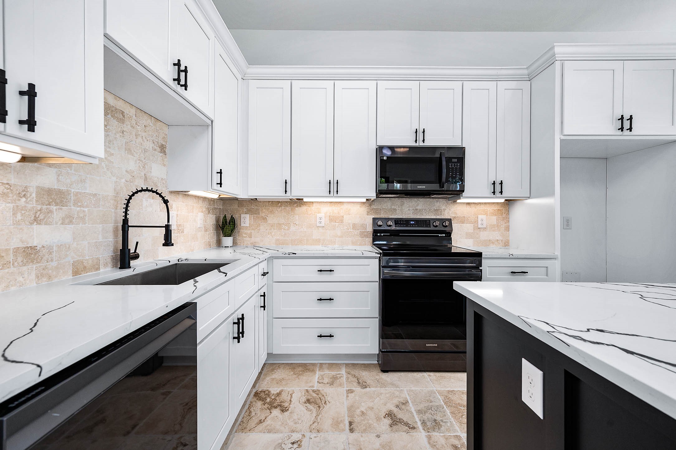 8903 Milby Street Needville, TX 77461 - Photo 12 of 32 a kitchen with a sink stove and cabinets